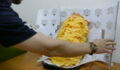 This man ordered a burger with 1000 cheese slices - the way he eats it is really something