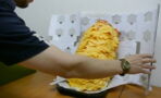 This man ordered a burger with 1000 cheese slices - the way he eats it is really something