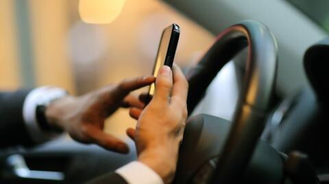 Use of handheld mobile while driving to become illegal next year