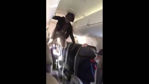'Demoniac Woman' Has a Complete Melt Down On Flight (VIDEO)