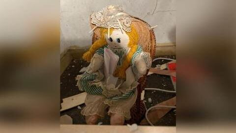 Man finds creepy doll and eerie note inside wall of new home