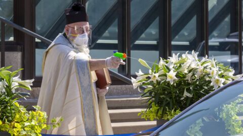 In Detroit, a Priest Is Battling Coronavirus With a Squirt Gun