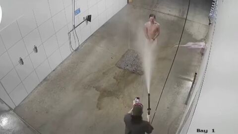 Bizarre footage shows man showering naked in a car wash
