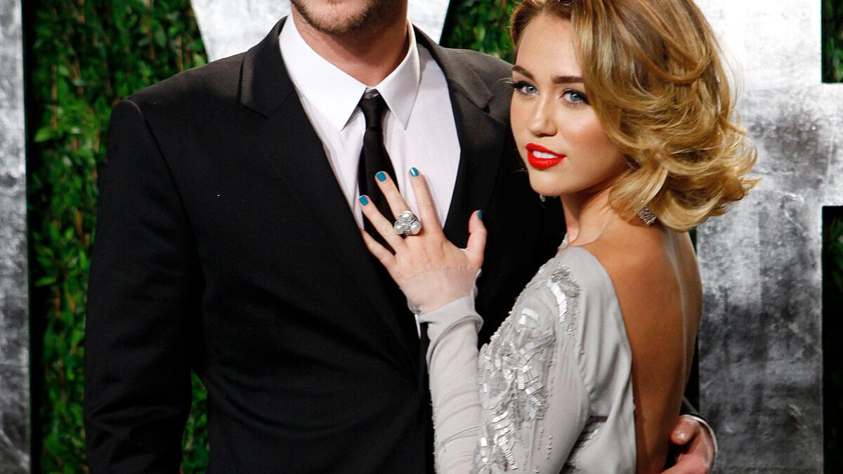 Miley Cyrus et Liam Hemsworth : Si jeunes et si amoureux, admirez leurs plus beaux clichés