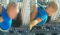 Social media users were shocked after one man dangled his kid off the balcony for likes