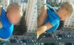 Social media users were shocked after one man dangled his kid off the balcony for likes