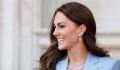 What is Kate Middleton wearing in her first official portrait with Prince William?