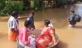 India floods: Couple sail to their wedding in a cooking pot