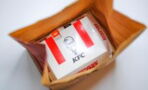 Stunned KFC customer finds a stack of cash underneath her chicken sandwich