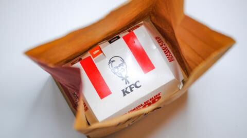 Stunned KFC customer finds a stack of cash underneath her chicken sandwich