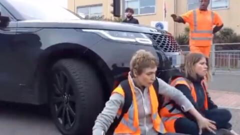 Furious mother drives into Insulate Britain protest with her luxury SUV