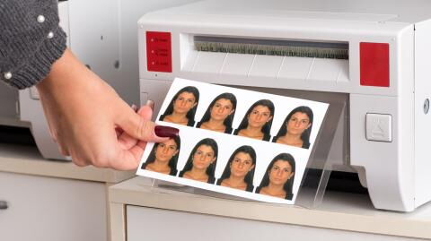 Here's the real reason why you aren't allowed to smile in your passport photo