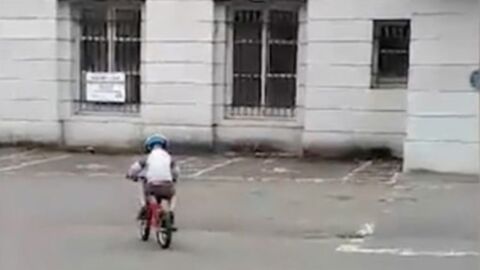 She was filming her son riding his bike when she noticed something horrifying