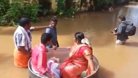 India floods: Couple sail to their wedding in a cooking pot 