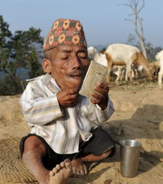 Chandra Bahadur Dangi from Nepal is recorded as the world’s smallest man at 1 foot 9.5 inches. Despite his short stature, he lived a full life and died at the age of 75.