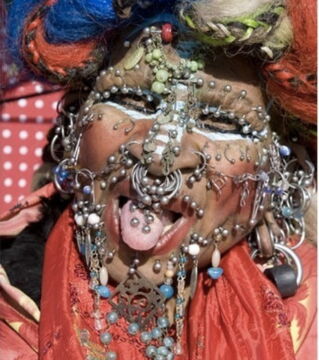 Elaine Davis is the world’s “Most Pierced Woman”. As of 2016, she had a total of 9,800.