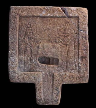 Offering table representing the jackal-headed god Anubis and the goddess Isis.