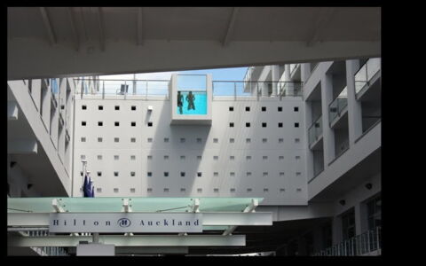 The Hilton Hotel in Auckland, New Zealand. It's right on top of the building and overlooks the streets.