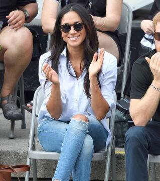 4. Meghan was spotted with Prince Harry at the Invictus Games semi-final tennis match wearing a subtle chic outfit. The white blouse is from Misha Nonoo and costs about £140 and her ripped jeans are from MOTHER Denim £170.