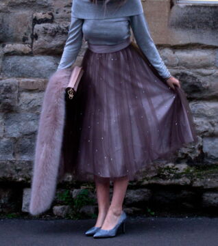 A fancy work event? Throw on a tulle skirt with a sweater top and pumps. Cute, classy, and stylish!
