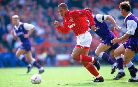 Ex-Liverpool and Aston Villa player, Stan Collymore, was pictured with a cigarette after being teargassed during a fan clash.