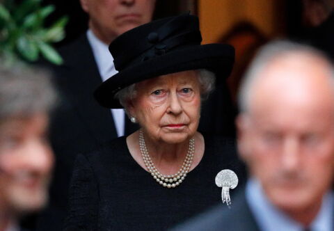 Queen Elizabeth II attending a friend's funeral