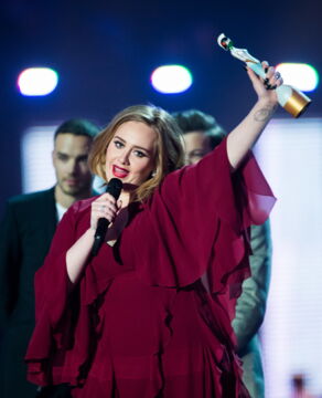 Adele accepts her Best Female Solo Artist Award at the BRIT Awards