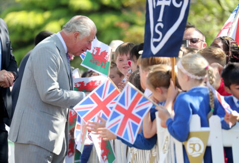 The Prince of Wales greeting children at Victoria Park in 2019 during the 50th Anniversary of his investiture.
