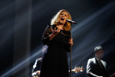 Adele performs on stage during The BRIT Awards