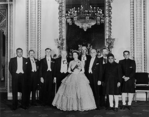 Queen Elizabeth II in a gown with a three-tier skirt